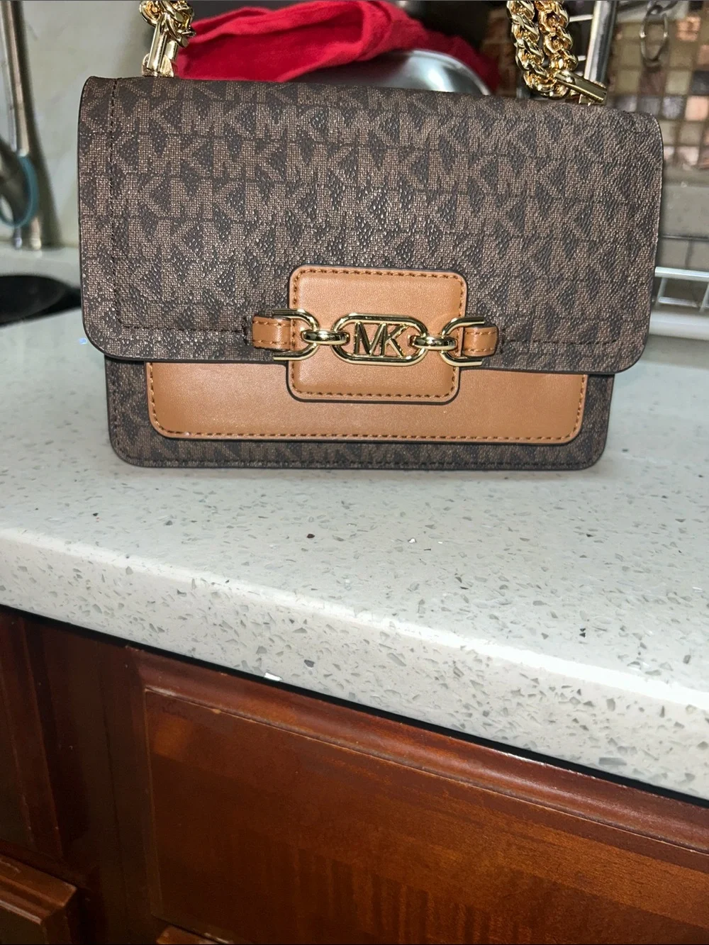 Like new Michael Kors Brown Logo Crossbody with Tan Leather and Gold Chain